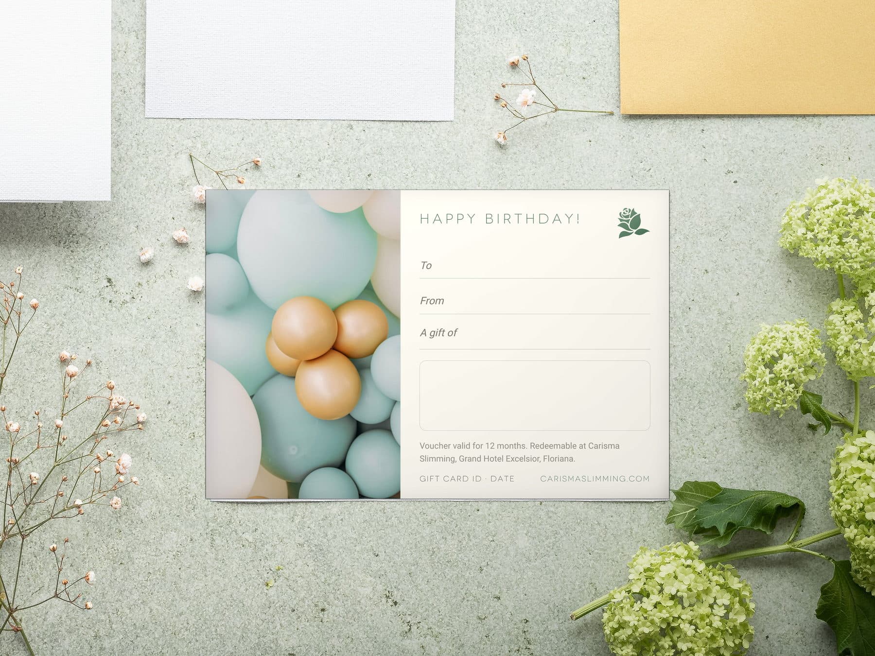Birthday Carisma Slimming gift card, styled flat-lay