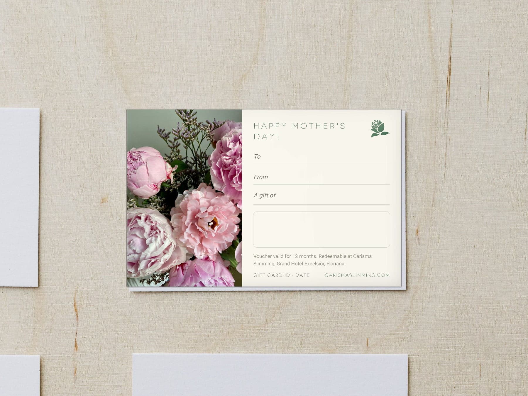 Mother's Day Carisma Slimming gift card, styled flat-lay